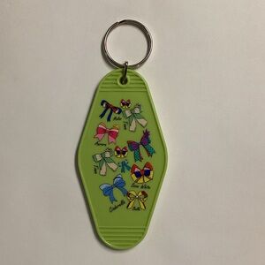 Green Keychain with Colorful Bow Designs